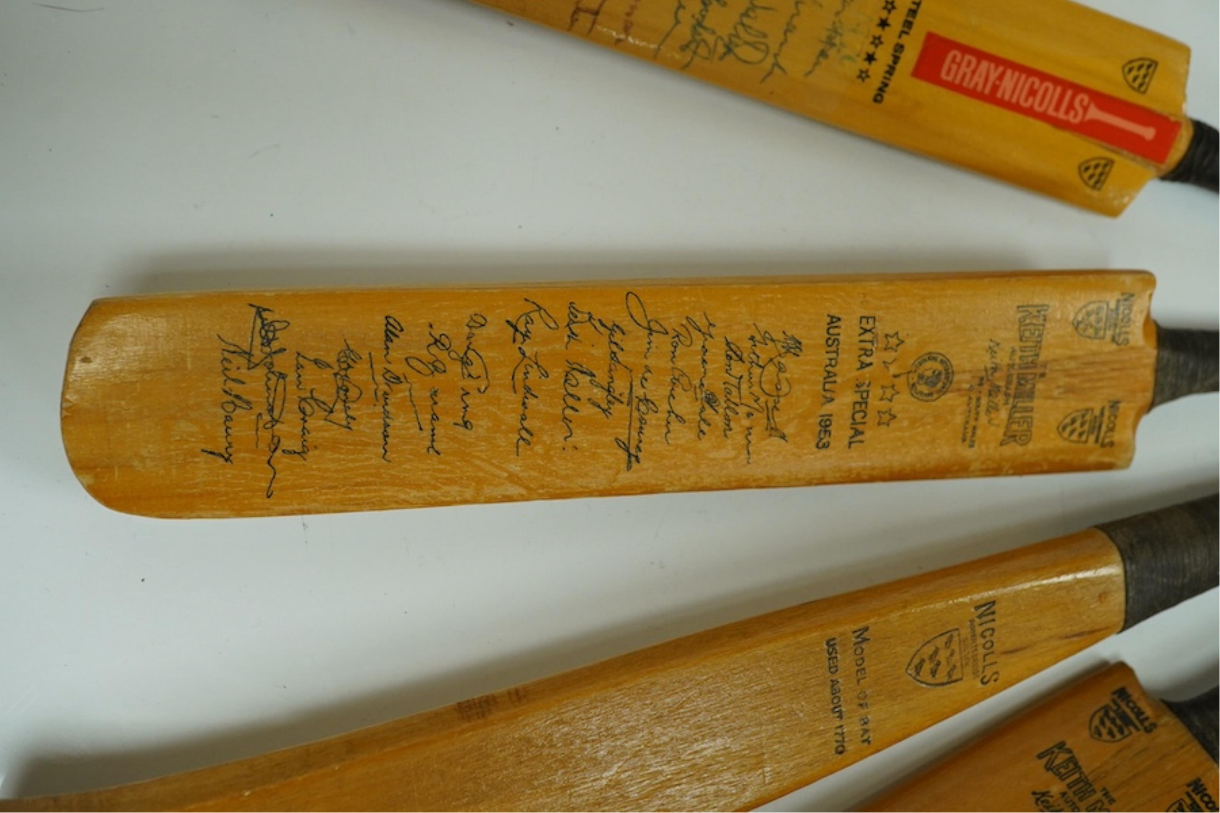 Four miniature model cricket bats, one signed, others printed. Condition - fair to good